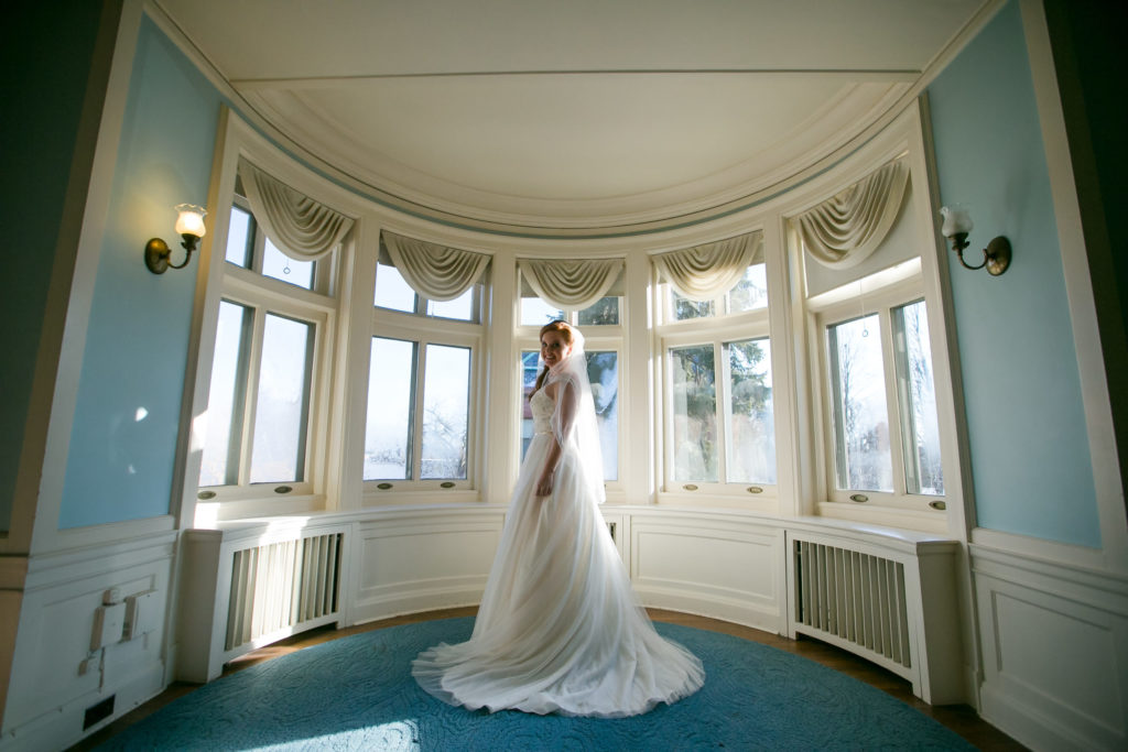Bride poses for indoor photo
