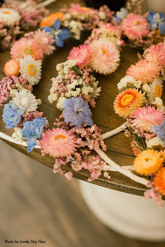 Assorted summer flower crowns for outdoor wedding