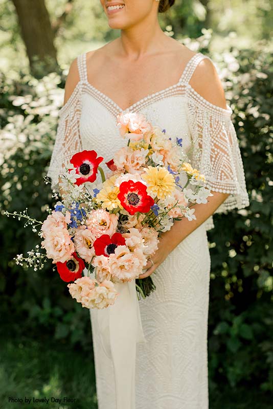 Wildflower bridal bouquet with red anemones
