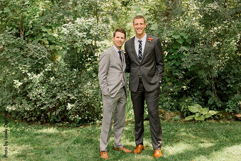 Groom and groomsman posing at a Minnesota wedding