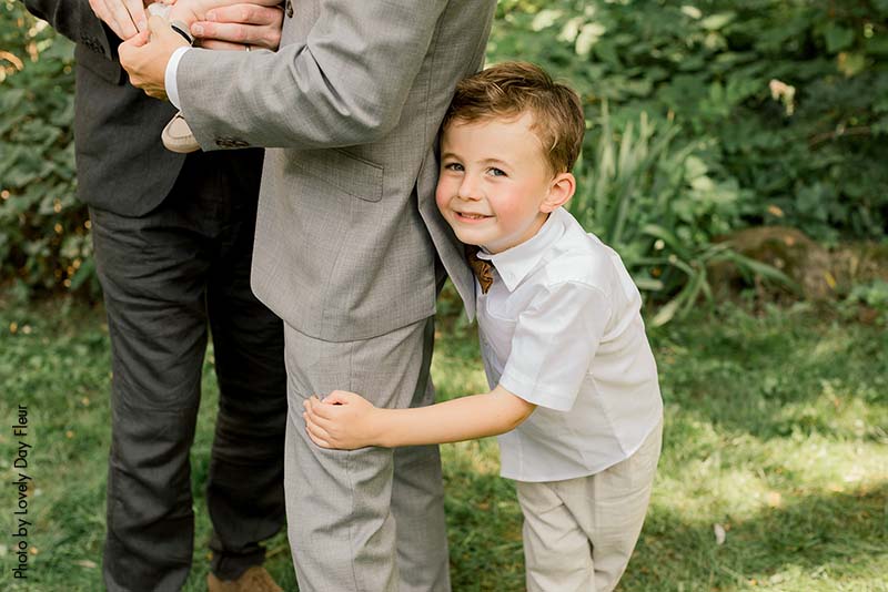 Ring bearer wearing a neutral outfit