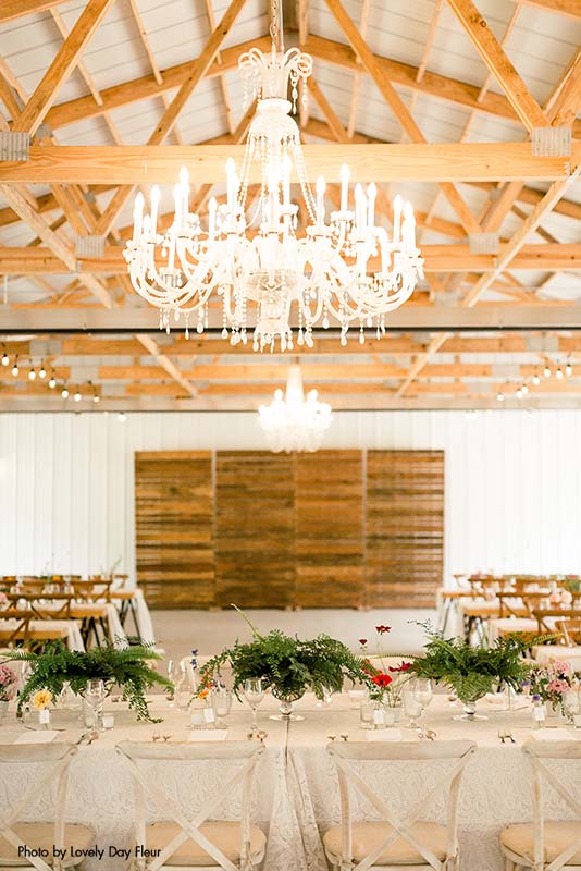 Modern and rustic wedding reception set up at Round Barn Farm