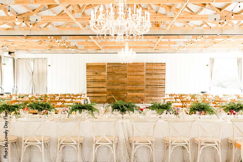Modern and rustic wedding reception set up at Round Barn Farm