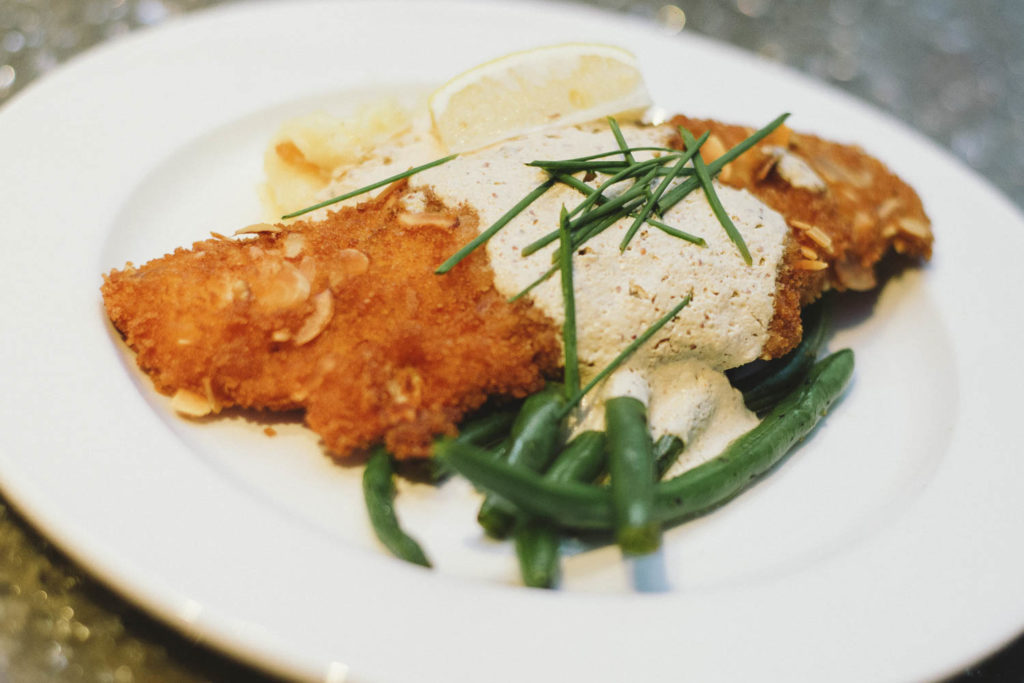 Plate of fish with green beans from virtual cooking class