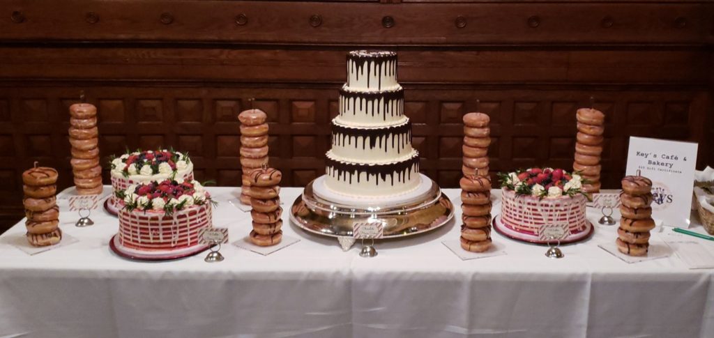 White wedding cake and donut tower by Keys Cafe and Bakery