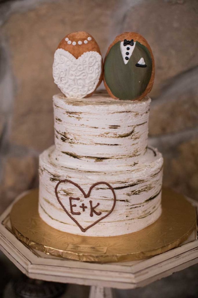 Birch wedding cake with two Mr & Mrs donuts on top
