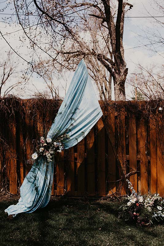 Blue triangle backyard wedding backdrop