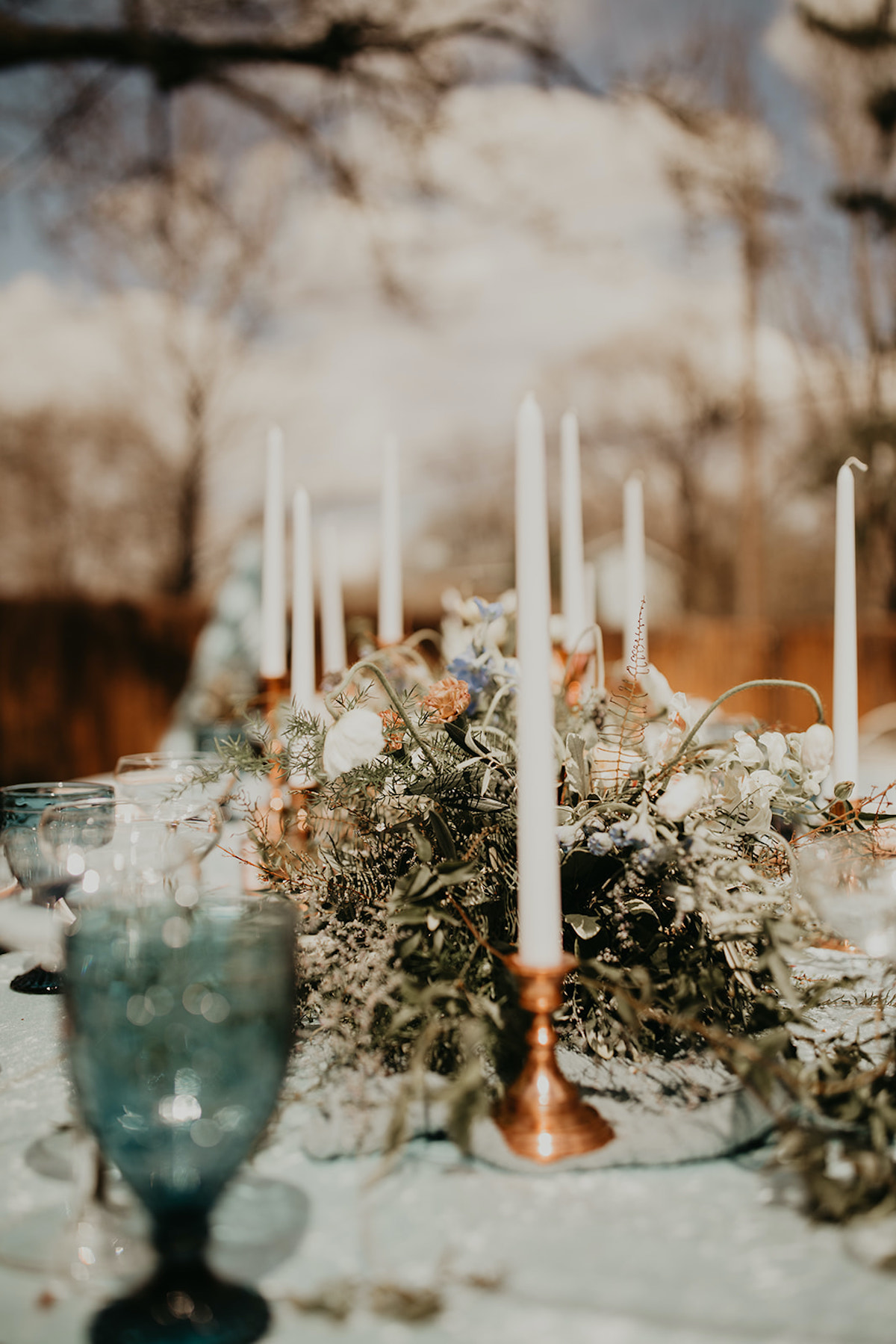 Vintage-inspired wedding floral running with vintage candle holders