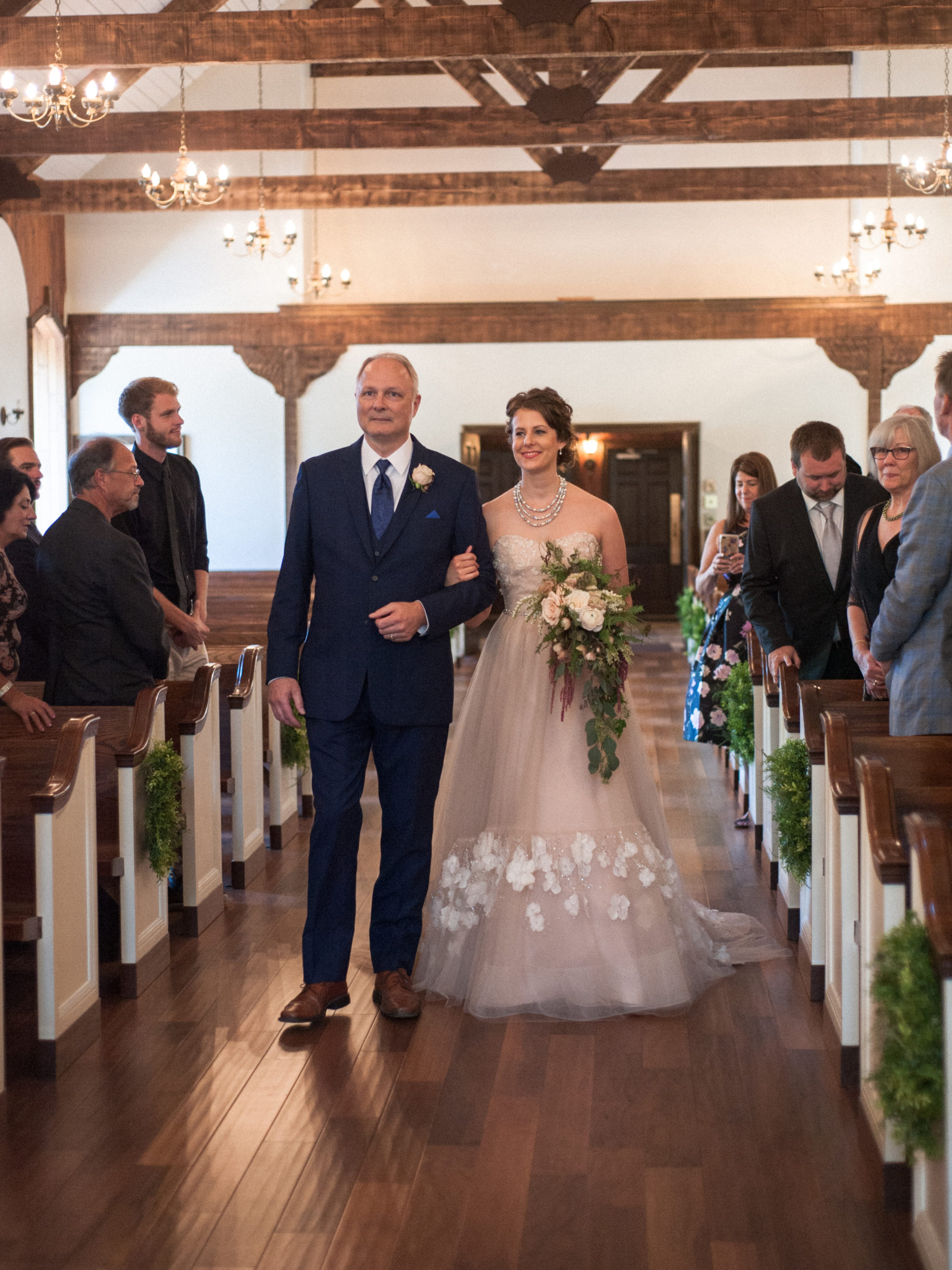 Bride is walked down the aisle by her step-dad