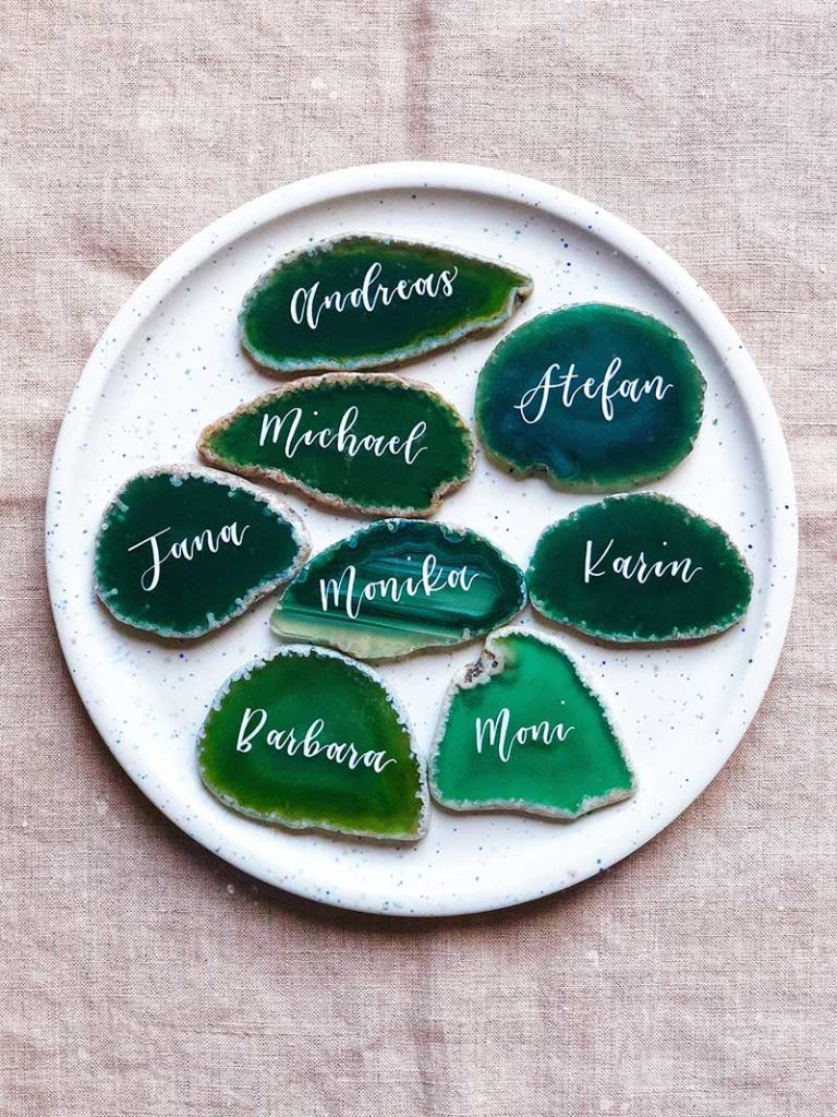 Green geode coasters with hand-written calligraphy