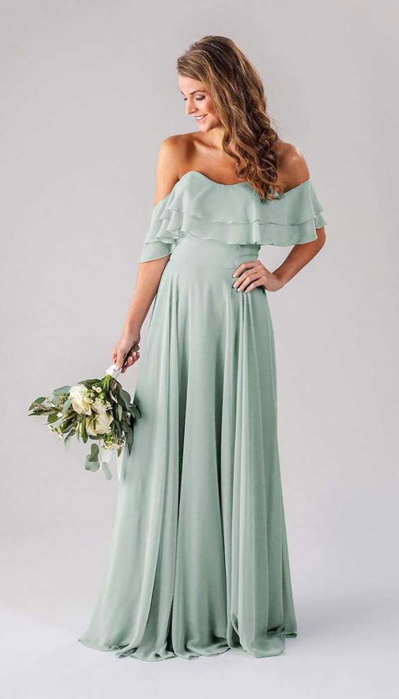 Woman in mint colored bridesmaid dress by Kennedy Blue