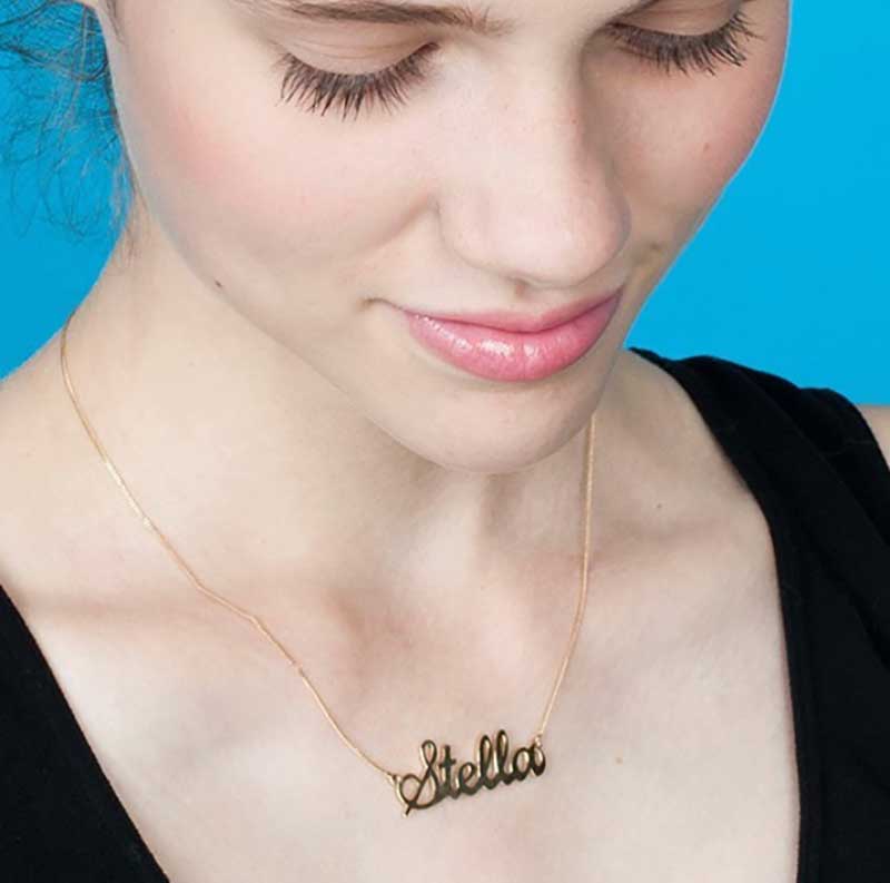 Girl wearing nameplate necklace 