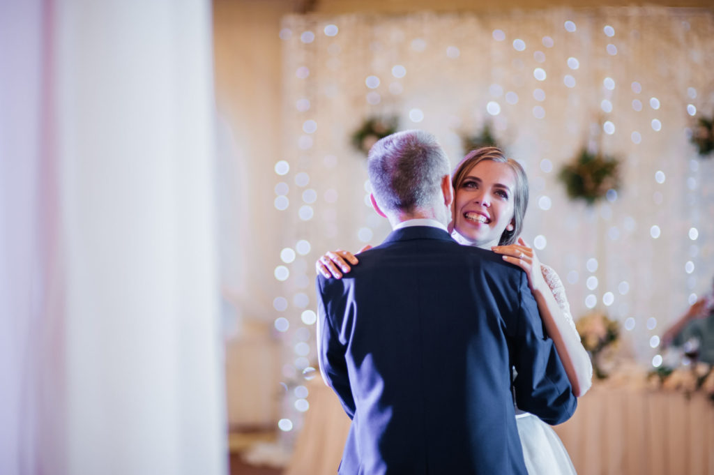 Bride include your stepdad in your wedding by sharing a dance 
