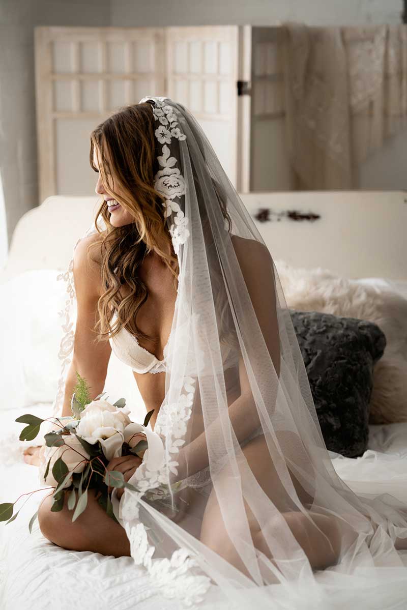 Bride in lingerie and long veil at 4 Girls Glamour boudoir photography shoot