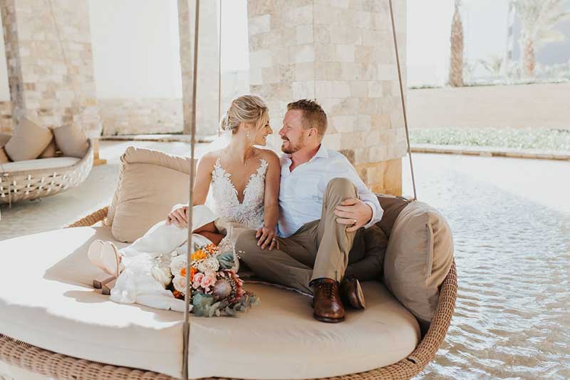 Couple on swing after destination wedding ceremony