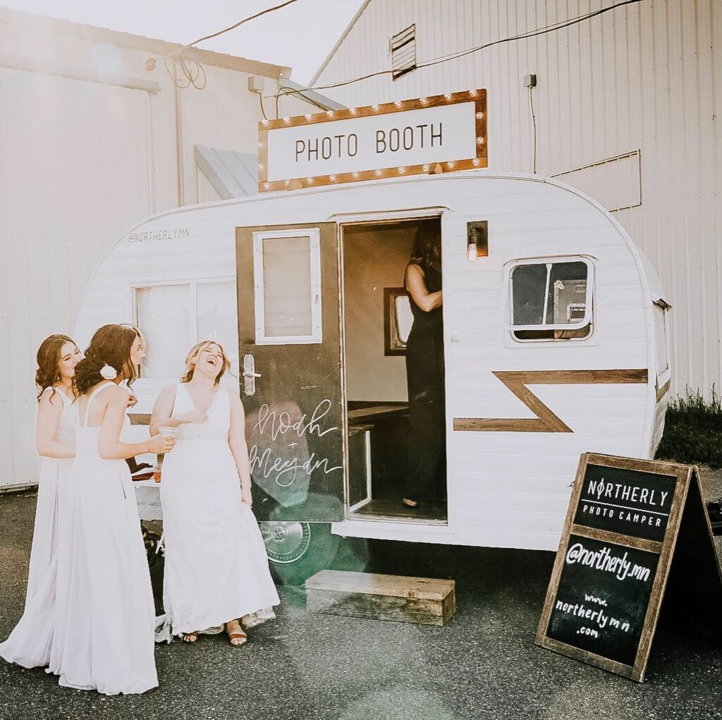 Bridesmaids with camper photo booth
