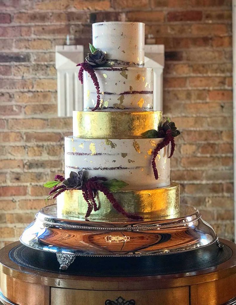 Modern gold and burgundy wedding cake by Flourish Cake Design