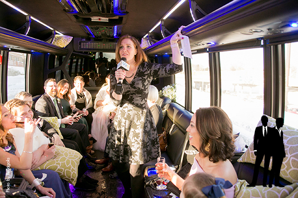 Someone giving a speech on the wedding party bus