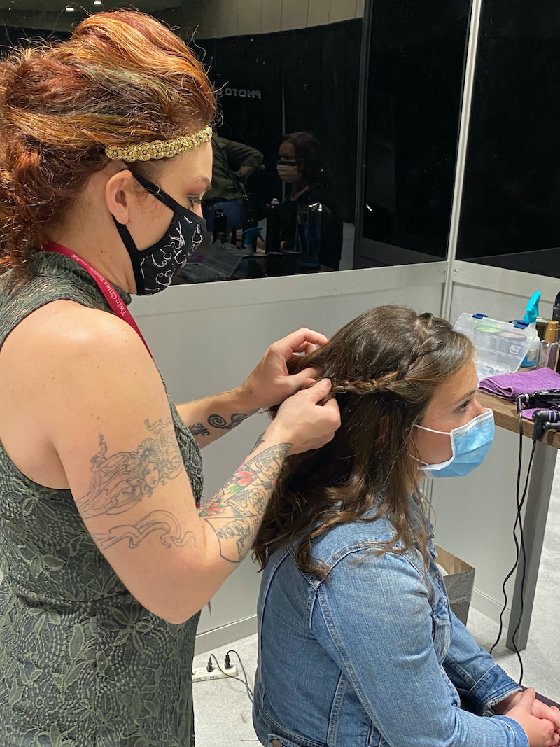 Bride gets hair done at the 2020 Twin Cities Bridal Show