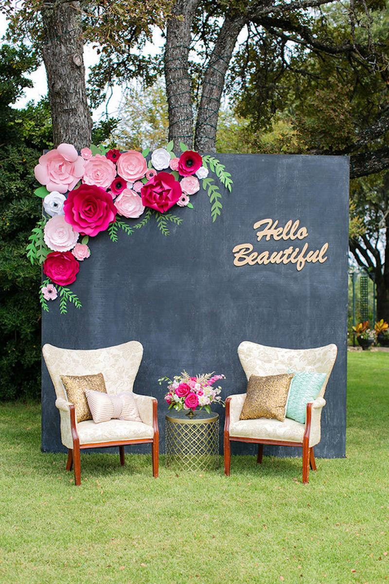 Creative photo backdrop with black wall and flowers