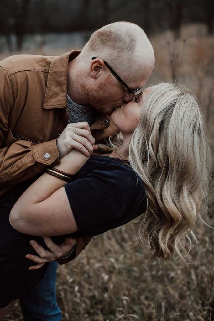 Couple kisses for fall engagement photo by Anna Ko Photography 