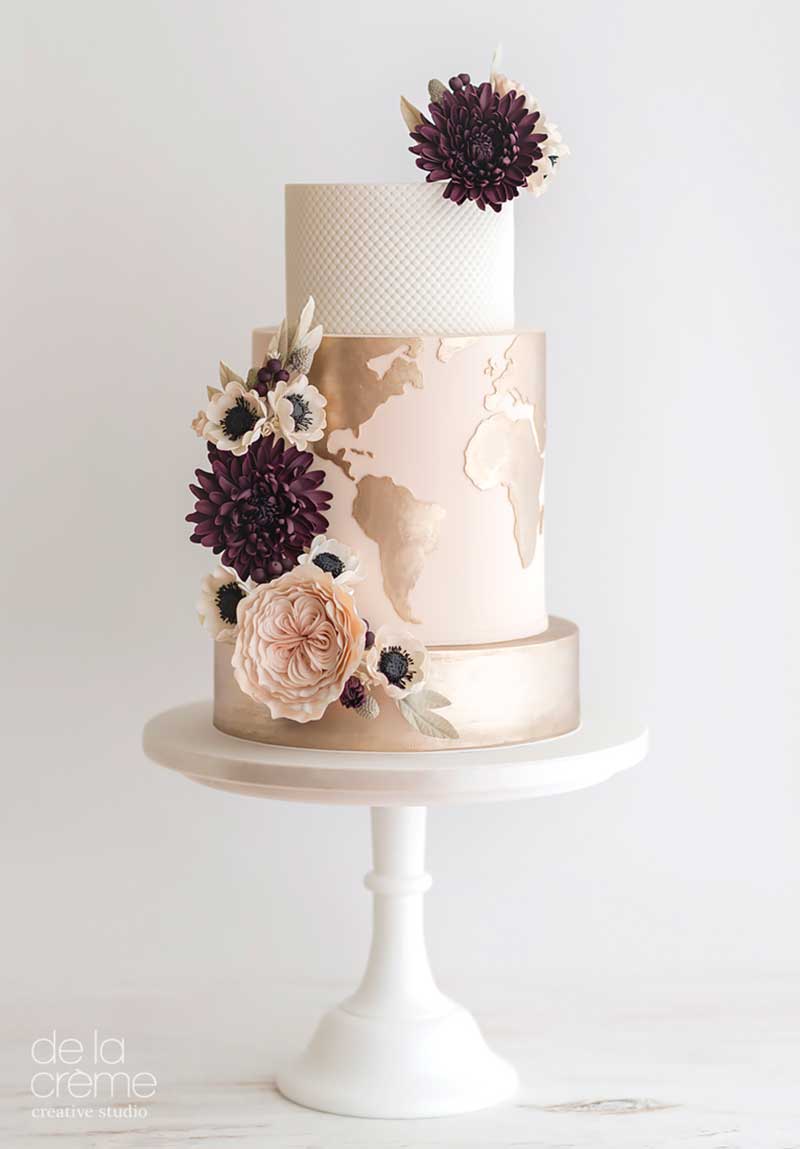Gold globe wedding cake by De La Creme