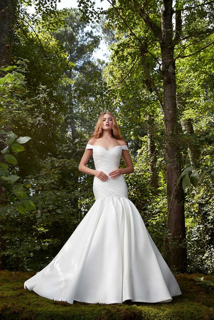 Fit and flare off the shoulder wedding gown by Anne Barge