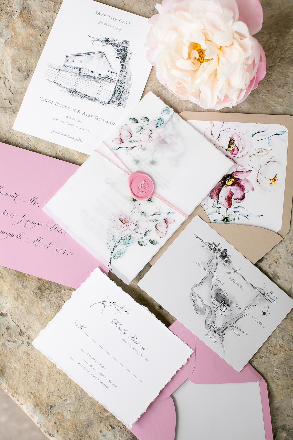 Pink, white, and floral wedding stationery 