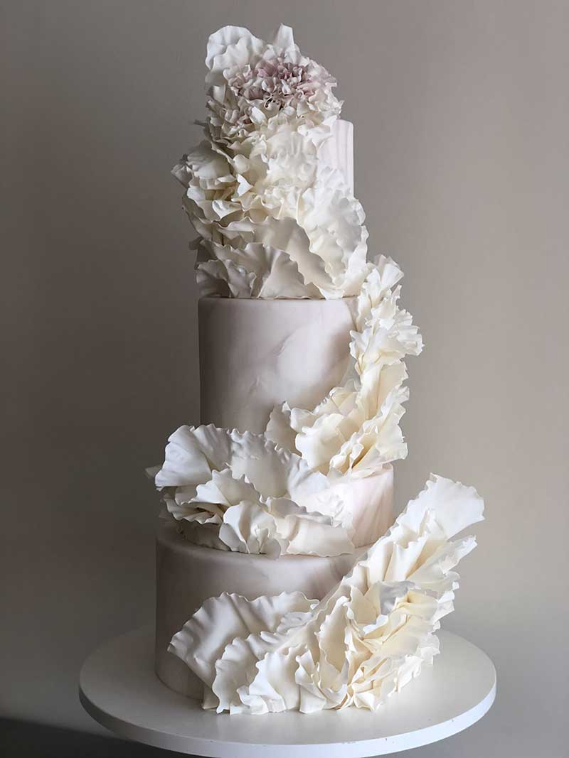 Intricate modern white wedding cakes