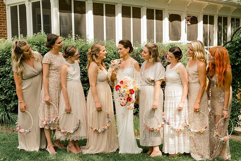 Bridesmaids in tan and white boho dresses 
