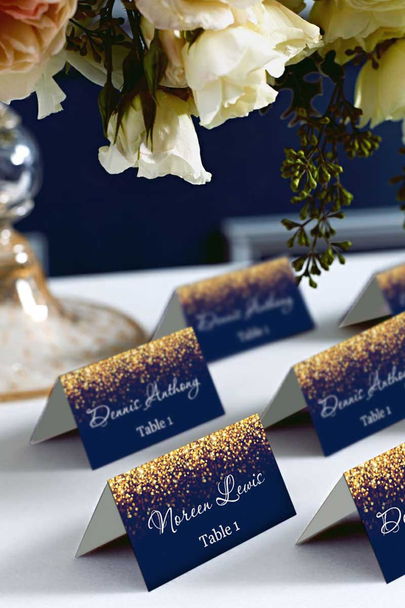 Navy blue and gold glitter table cards for wedding