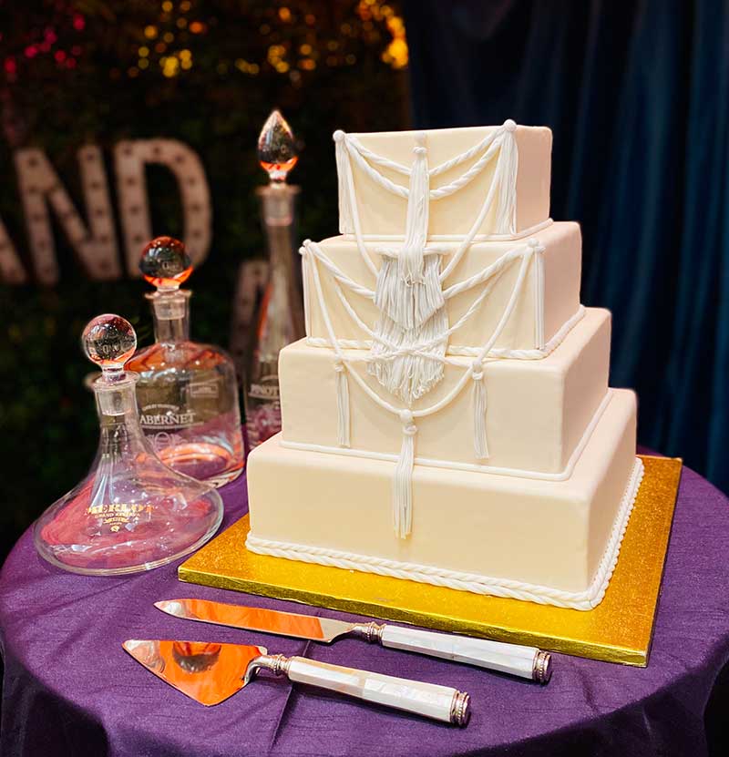 White and ivory 4-tier boho wedding cake by Keys Cafe & Baker