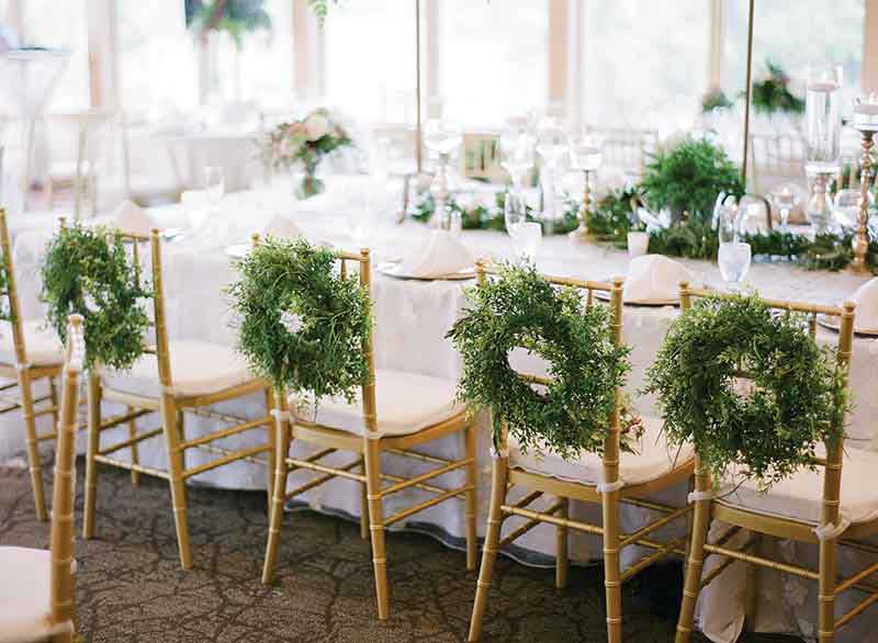 Wedding decor details in white, green, and gold 