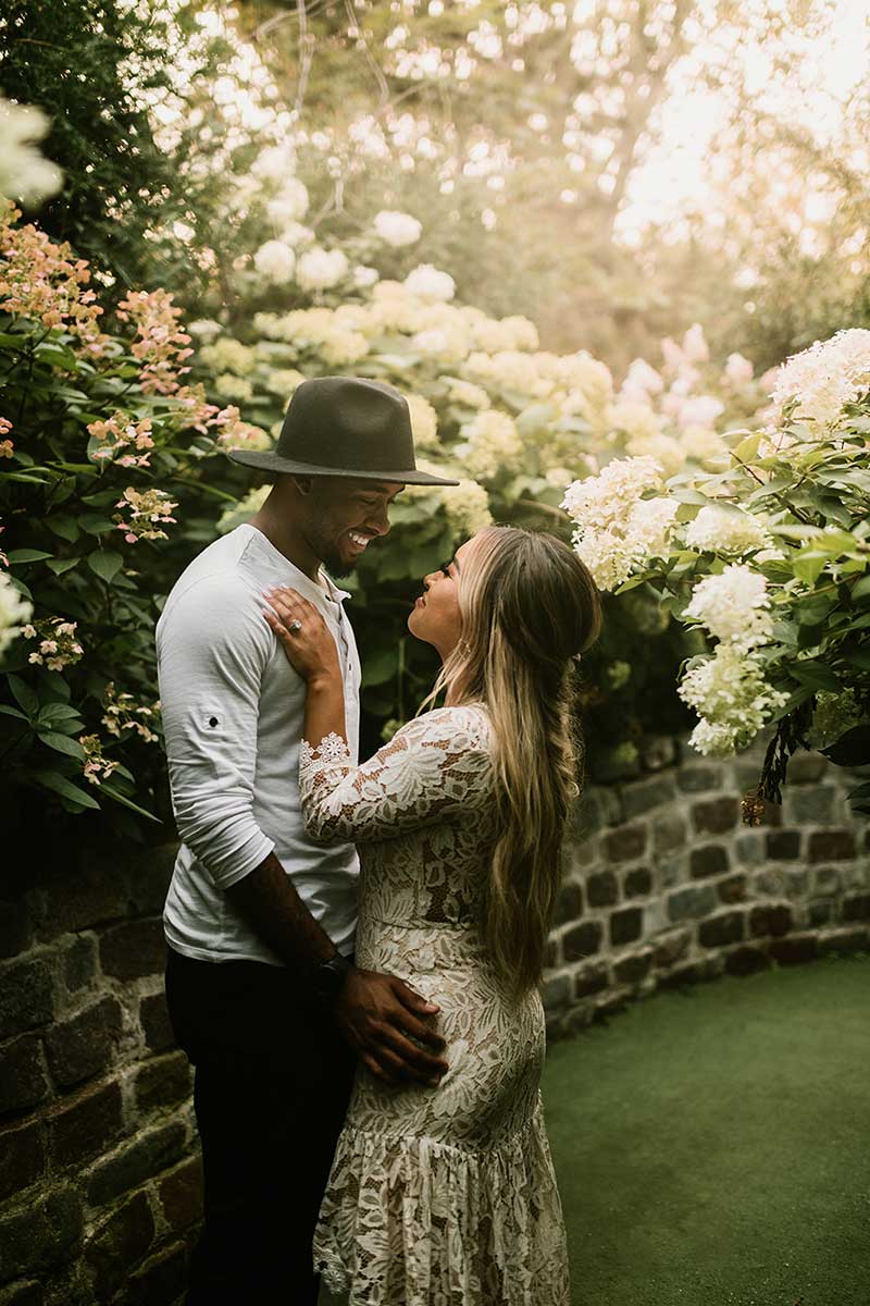 Couples takes engagement photos in garden