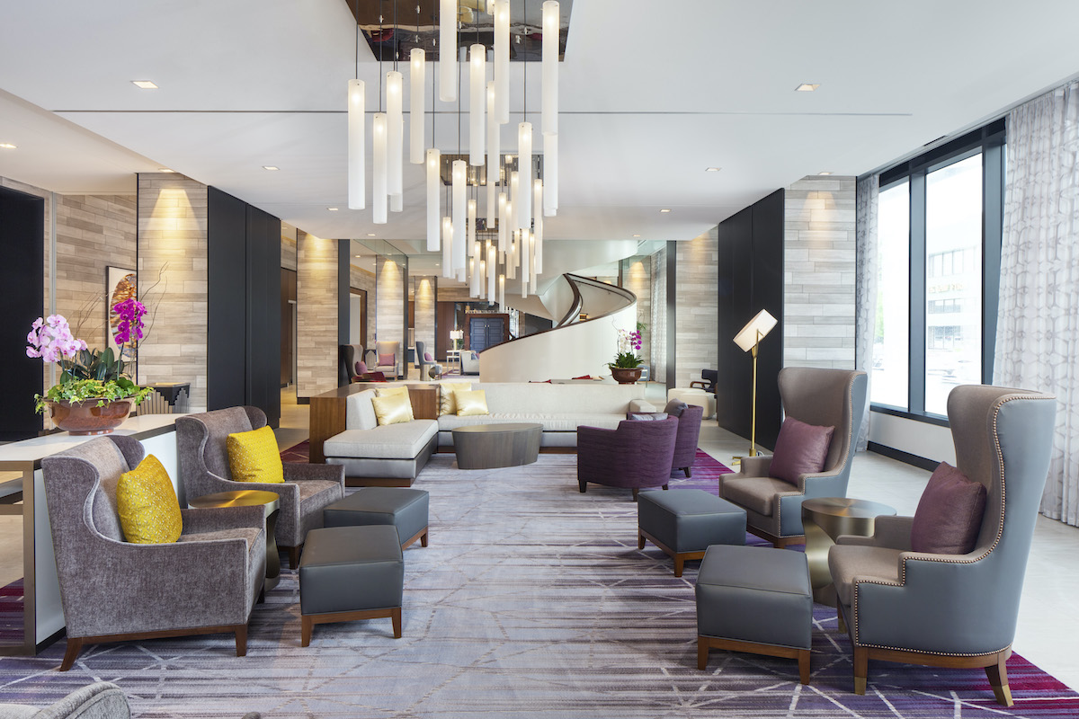 Stylish hotel lobby with modern decor and chandeliers in downtown Rochester, Minnesota
