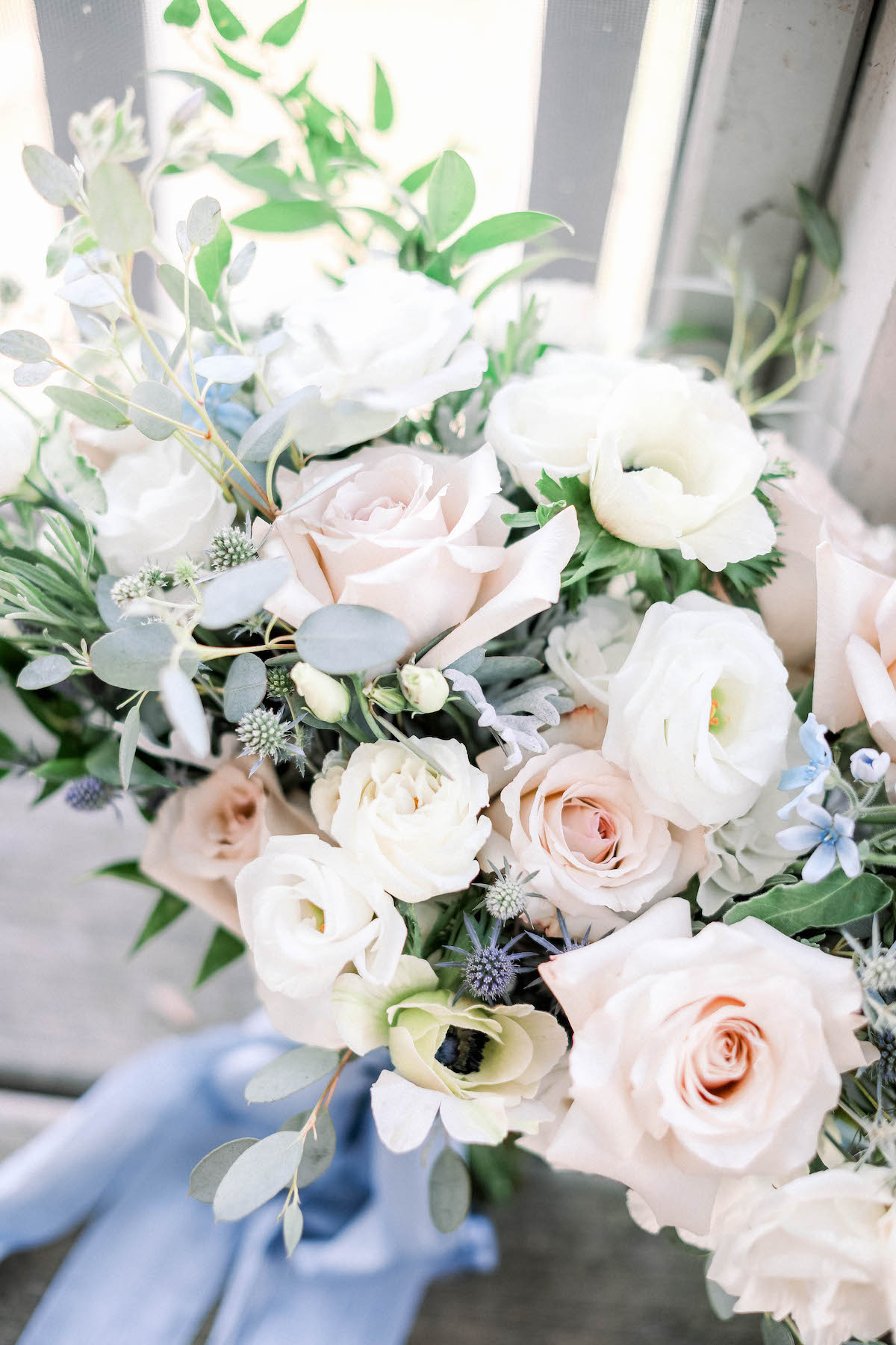 Light and airy bridal bouquet with blush and pale blue 