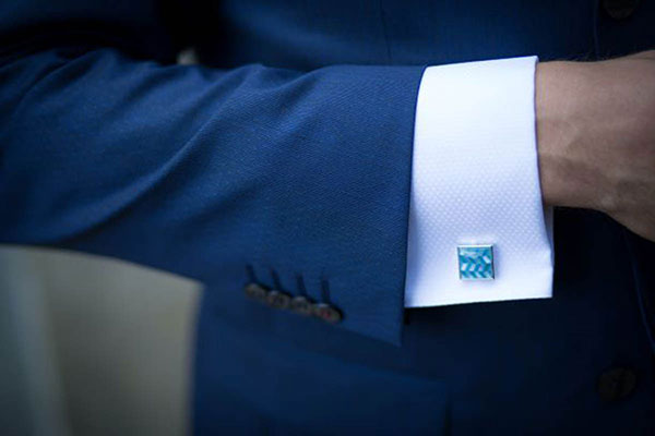 Light blue jewel cuff link on white button up from Daniel's Custom Clothing