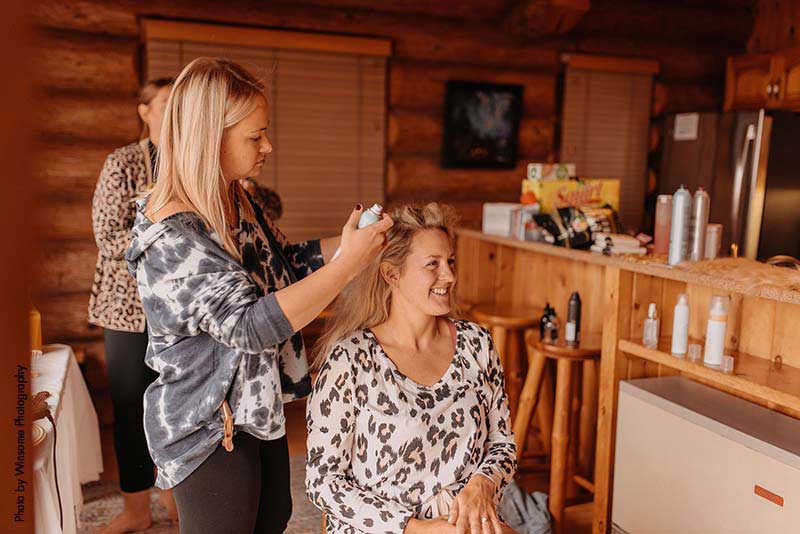 Bride gets her hair done before wedding