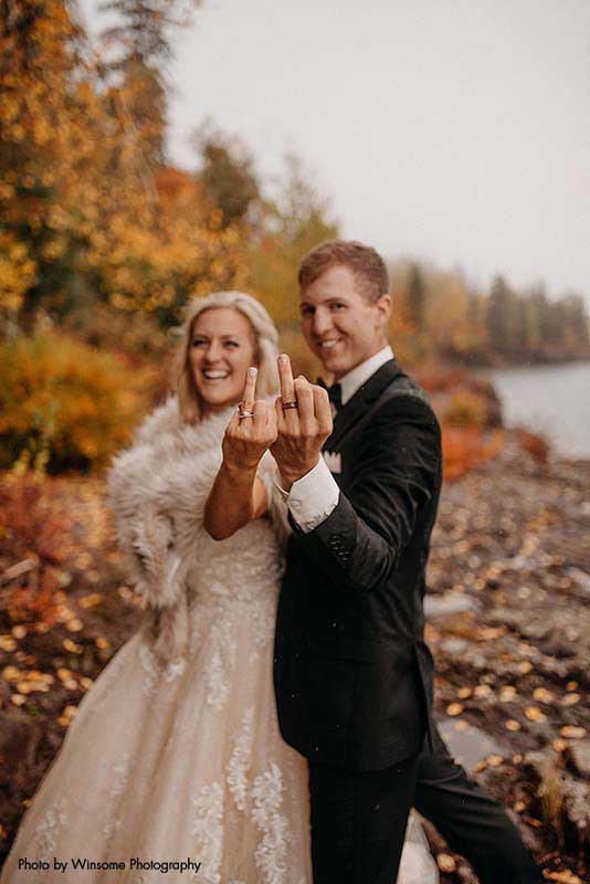 Bride and groom show off rings after Minnesota wedding ceremony