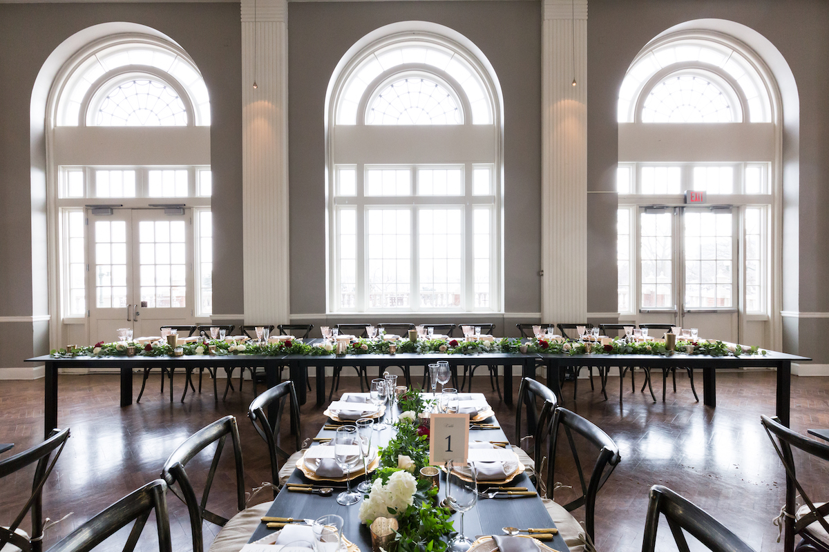 Harvest-style table seating at wedding in Minneapolis, MN