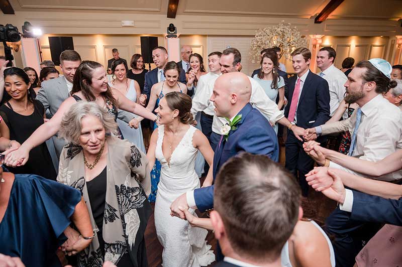 Couple dances to music at wedding from the 2021 wedding song guide