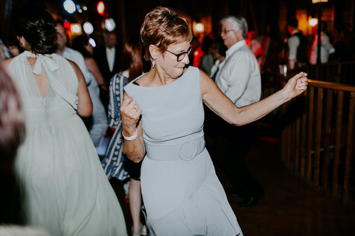 Mother of the bride dances at wedding reception