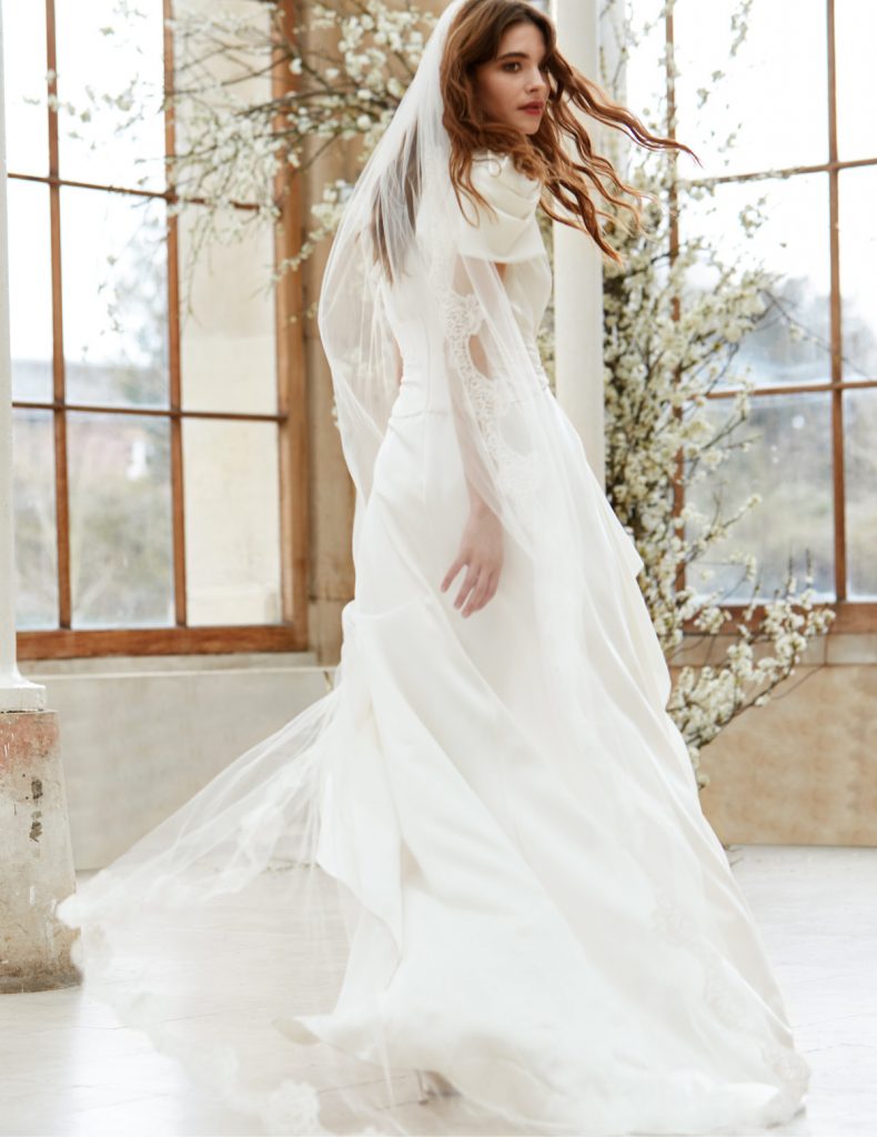 Draped bridal gown with waterfall skirt 
