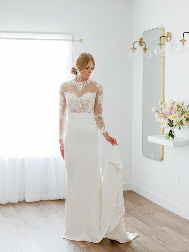 Chantilly lace long-sleeve bridal gown with crepe skirt