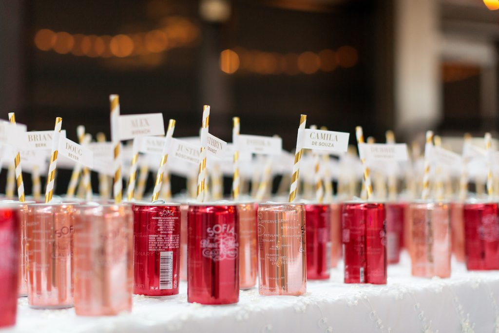 Wedding signage idea escort cards in drink cans 