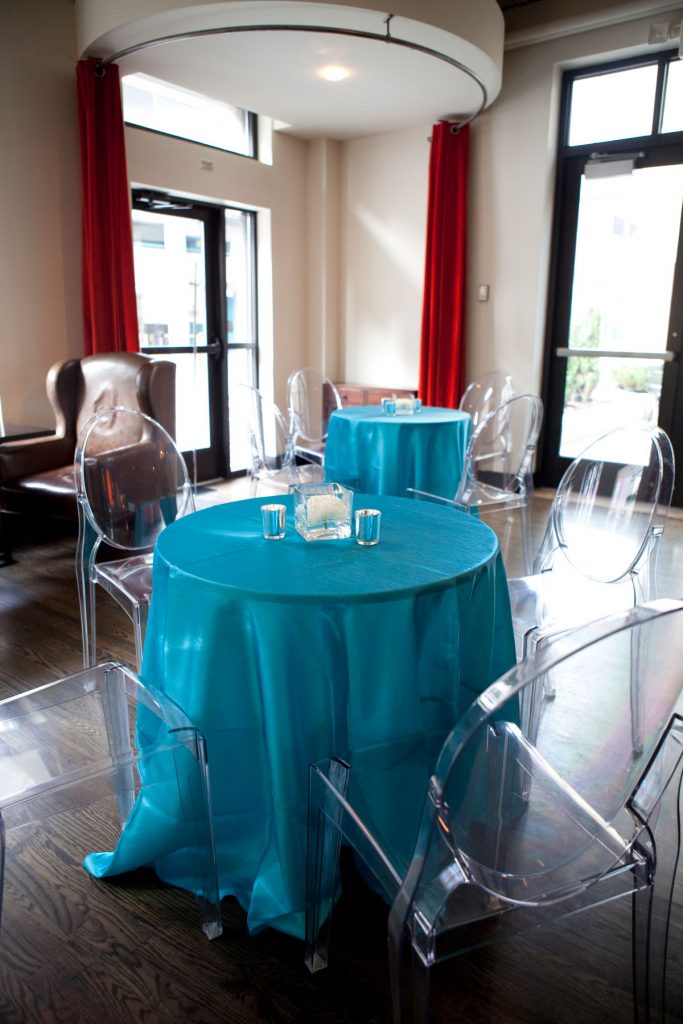 Teal wedding table linens with clear acrylic chairs