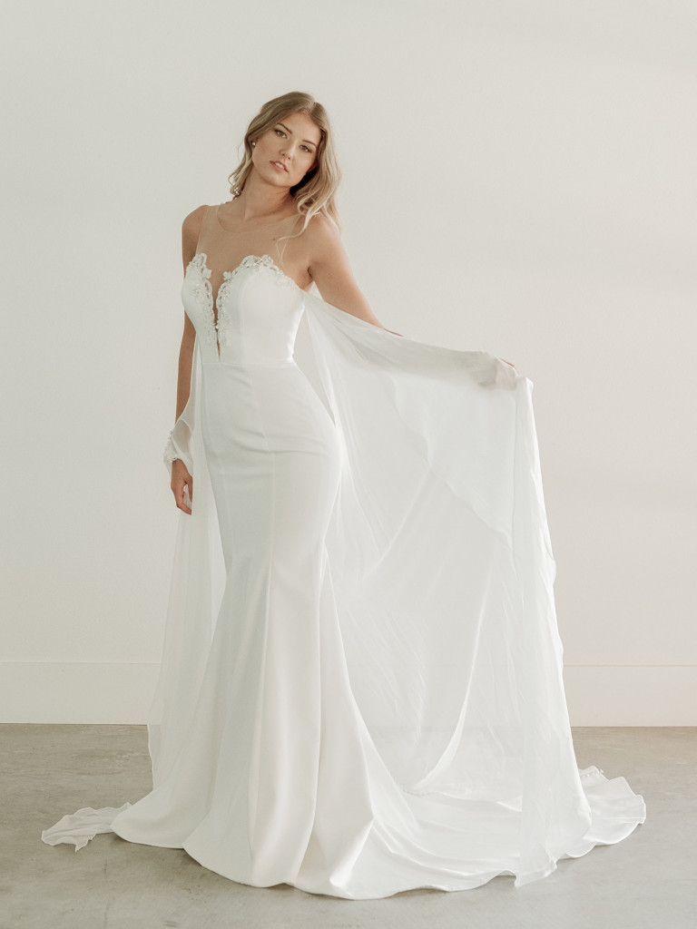 Plunging neckline beaded bridal gown with cape 