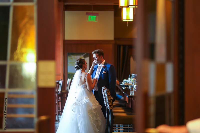Bride in a white dress and groom wearing a blue suit