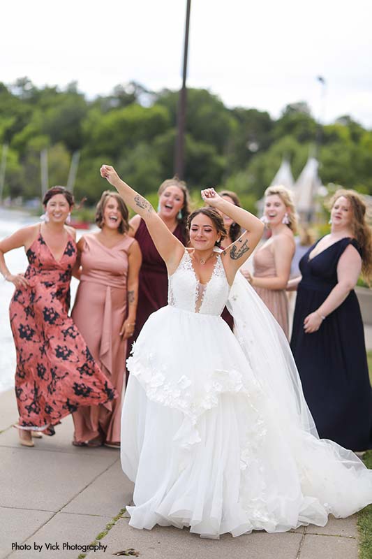 Bridesmaids in assorted colored dresses