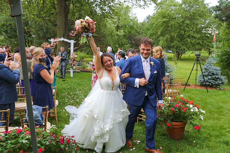 Bride and groom celebrate backyard micro wedding